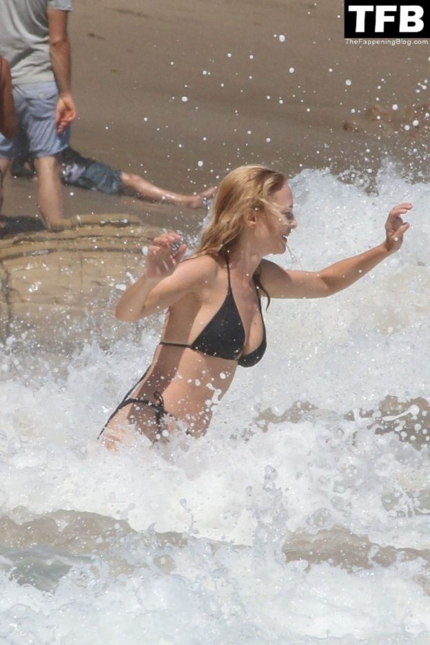 Heather Graham Slips Into A Black Bikini For A Beachside Frolic Next To