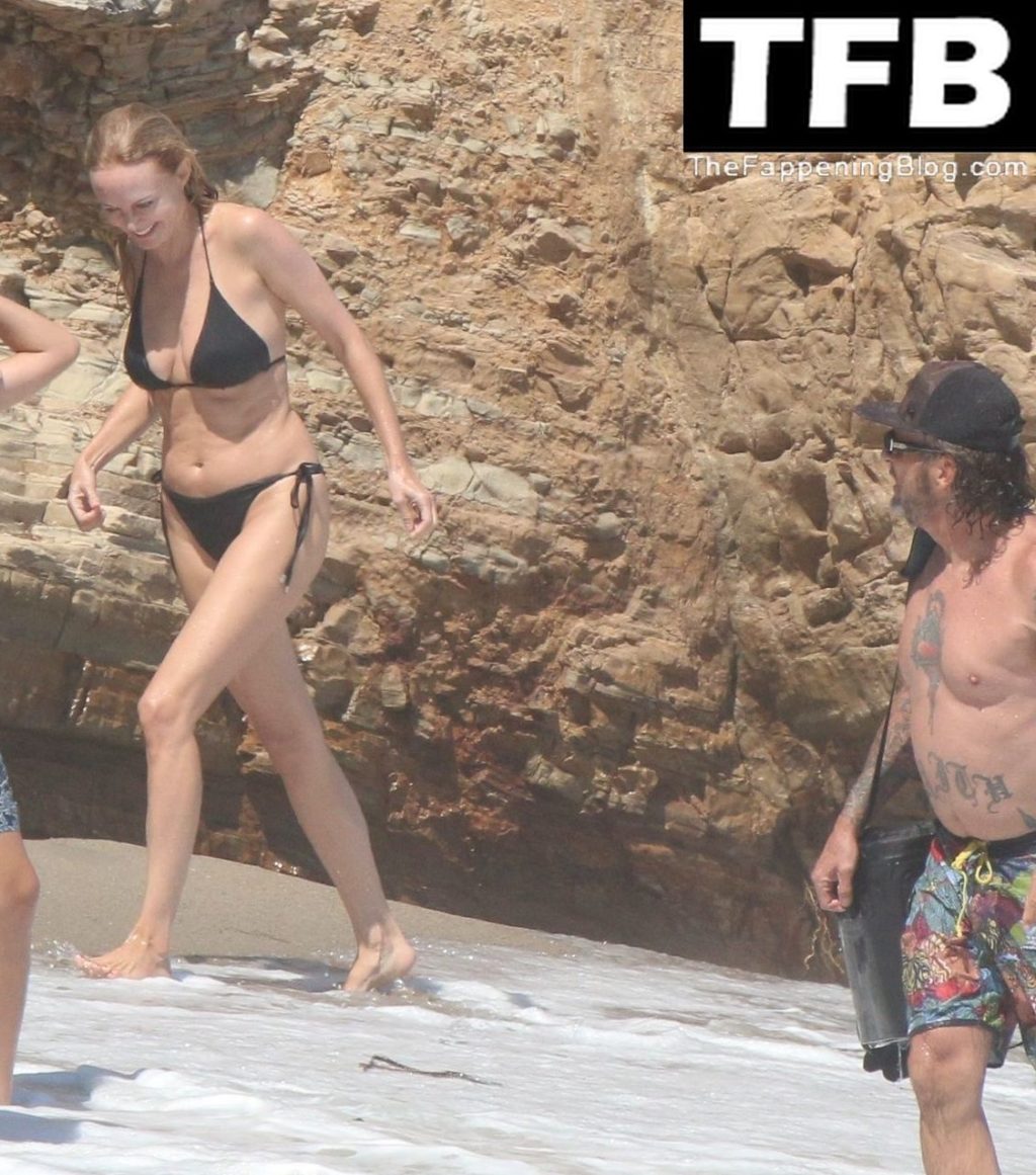 Heather Graham Slips Into A Black Bikini For A Beachside Frolic Next To