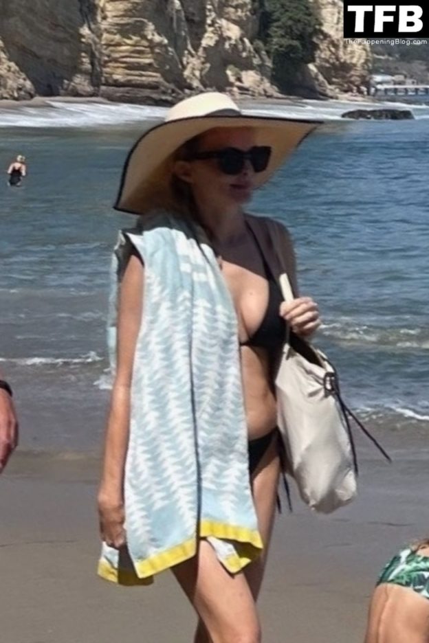 Heather Graham Slips Into A Black Bikini For A Beachside Frolic Next To