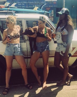 Emily Bett Rickards - chillin next to a station wagon 60014913_ebr.jpg