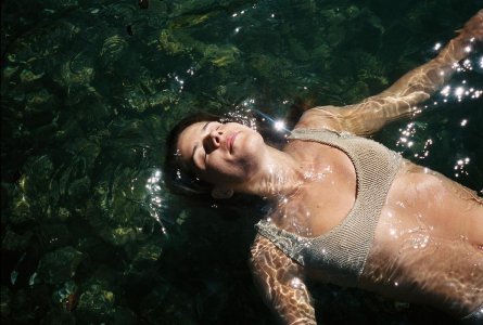 Emily Bett Rickards - floating in water.jpg