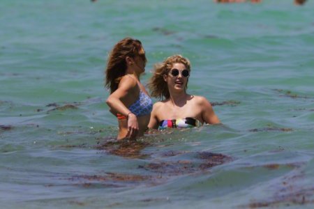 Katie Cassidy & Emily Bett Rickards - at a beach in Miami ebr (10).jpg