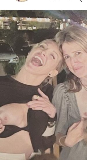 Katie Cassidy - showing her right breast k1st9eip3x691.jpg