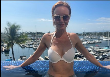 Lindy Booth - in a white bikini or bra top.jpg