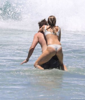 Miley Cyrus and Liam Hemsworth Swimming in Australia.jpg