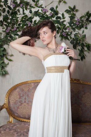 tempting-brunette-in-beautiful-white-dress-showcasing-her-hairy-pussy-on-the-sofa-02 thefappen...jpg