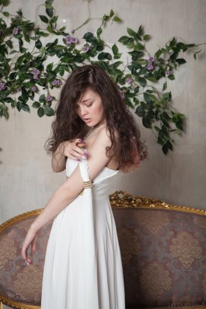 tempting-brunette-in-beautiful-white-dress-showcasing-her-hairy-pussy-on-the-sofa-03 thefappen...jpg