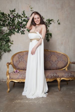 tempting-brunette-in-beautiful-white-dress-showcasing-her-hairy-pussy-on-the-sofa-04 thefappen...jpg