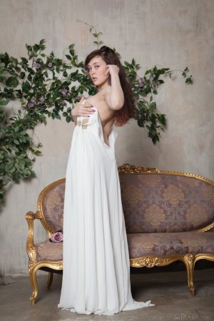 tempting-brunette-in-beautiful-white-dress-showcasing-her-hairy-pussy-on-the-sofa-05 thefappen...jpg