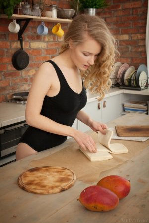 curly-blonde-goddess-shows-off-her-cooking-skills-naked-and-teases-with-her-delectable-body-01...jpg