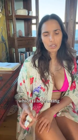 Padma Lakshmi making essential oil in bikini ME153FJB_o.jpg