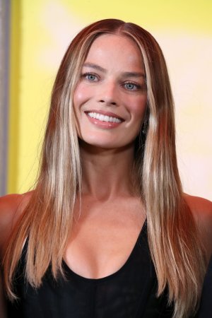 margot-robbie-unveils-sheer-stella-mccartney-at-la-photocall-12.jpg