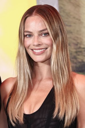 margot-robbie-unveils-sheer-stella-mccartney-at-la-photocall-14.jpg