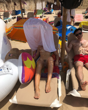 Dove Cameron - wearing a bikini and covering her face at a beachWa6p7jw8_o fake.png