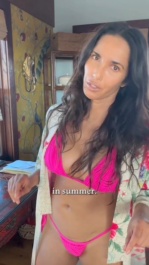 Padma Lakshmi making essential oil in bikini ME153FJ4_o.jpg