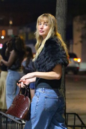 Jennifer Lawrence - looks classy and elegant wearing fur with jeans in New York September 18, ...jpg