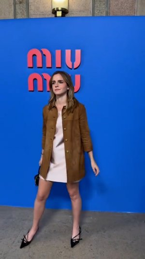 Emma Watson - Leggy in a pale pink mini dress 23.jpg