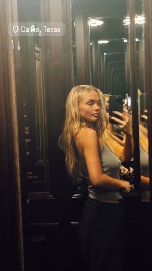 Natalie Alyn Lind - taking a selfie in a mirror.jpg