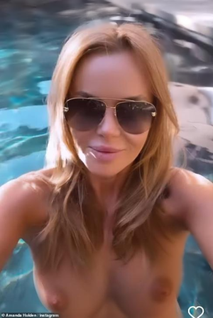 346262570_69560479-11946987-stunning_the_britain_s_got_talent_judge_52_posed_for_a_boomera fake.png