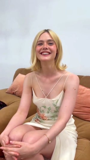 Elle Fanning in a silk gown adorned with floral embroidery 9.jpg