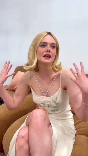 Elle Fanning in a silk gown adorned with floral embroidery 18.jpg