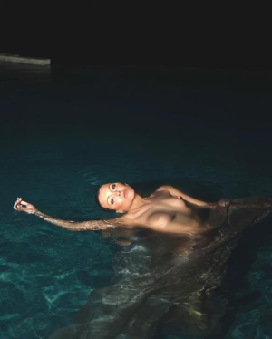 Katie Cassidy - chillin in a pool kc__1_ fake.png