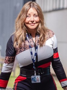 Carol Vorderman displays her smooth complexion and eye-popping curves.jpeg