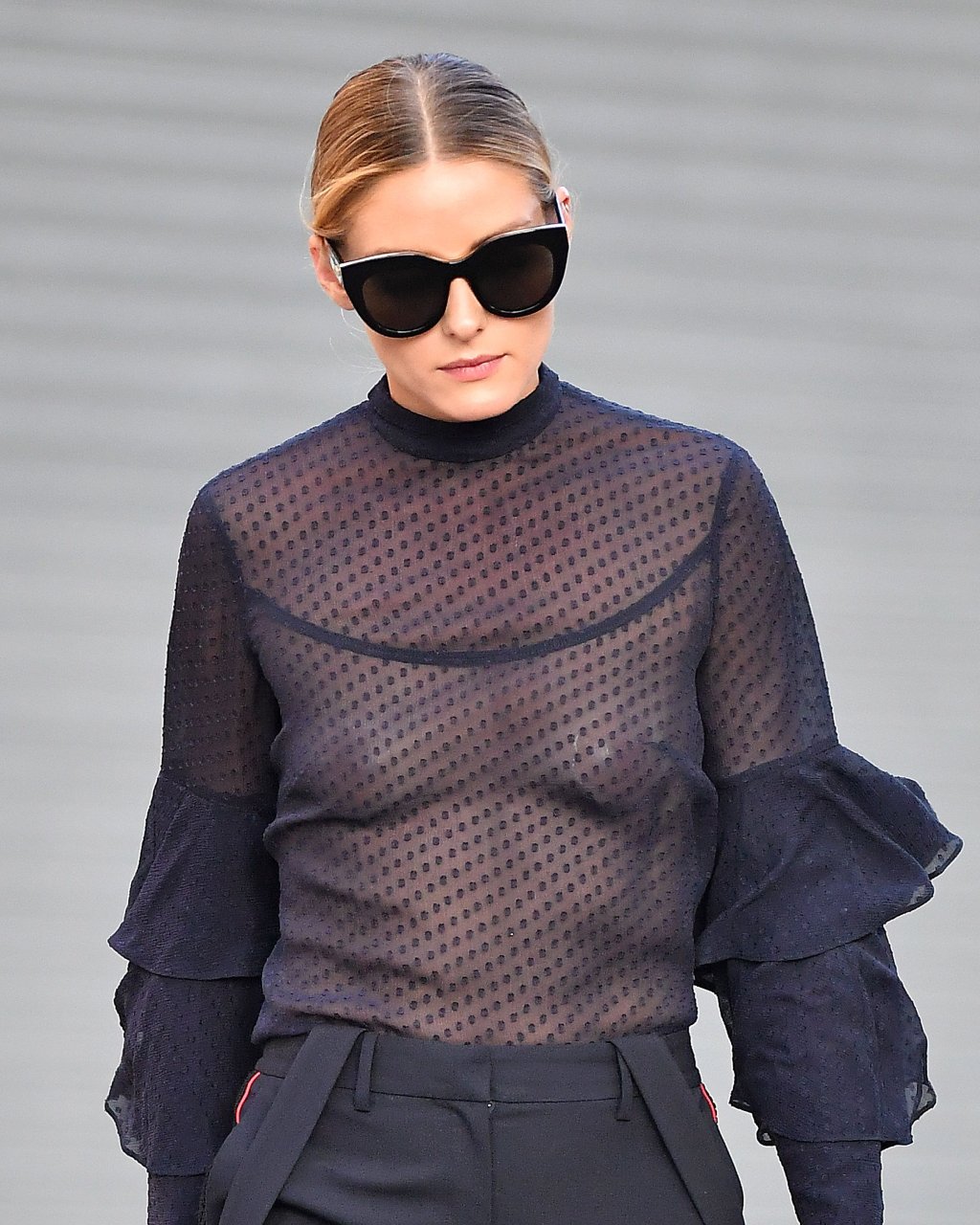 Olivia Palermo wears a black sheer top with pasties while exiting her apart...