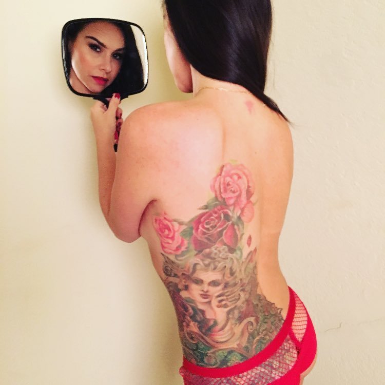 Tattooed hottie Danielle Harris poses topless - Instagram, 12/21/2017. 