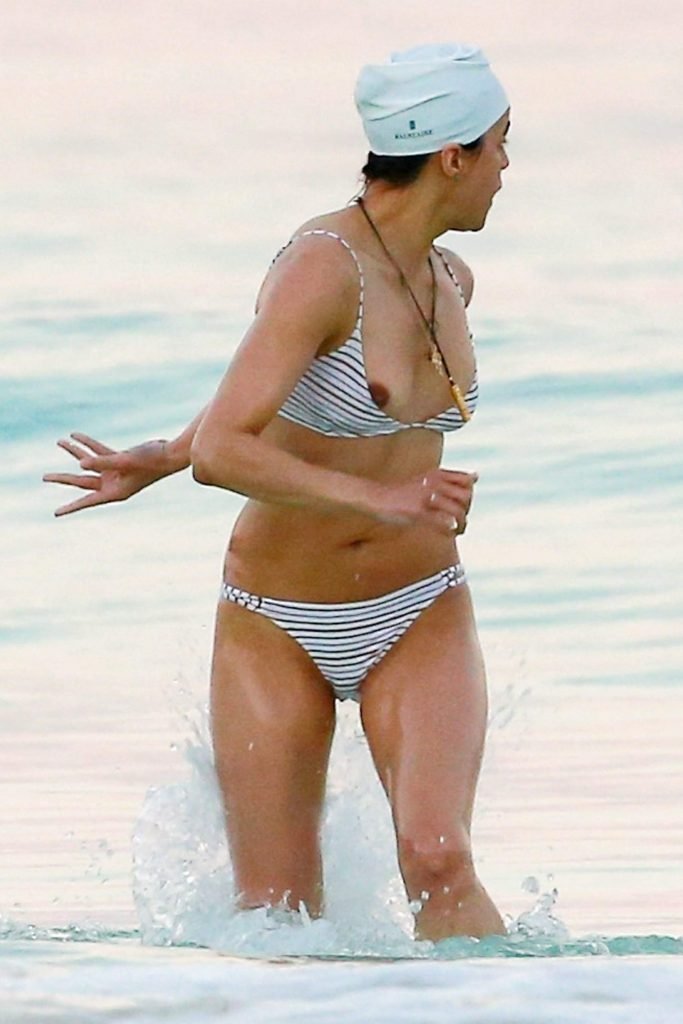 Actress Michelle Rodriguez flashes her nipple on the beach in Tulum, Mexico...