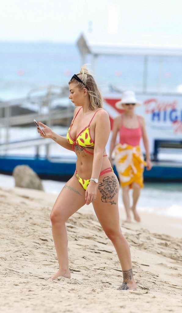 Olivia Buckland Displays Her Tattooed Body in Barbados (29 Photos + Video)