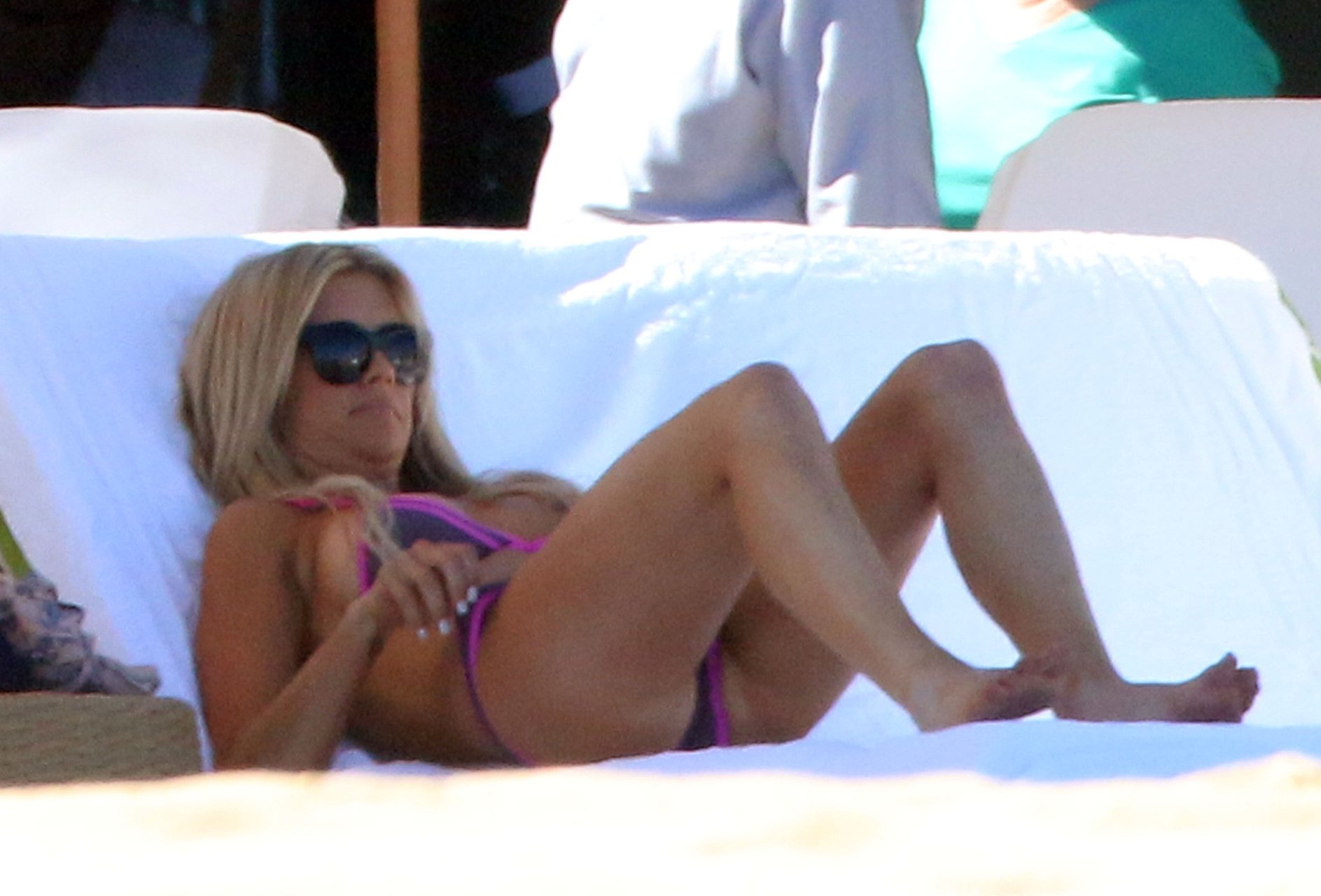 Christina El Moussa and Ant Anstead enjoy a day while sunbathing poolside d...