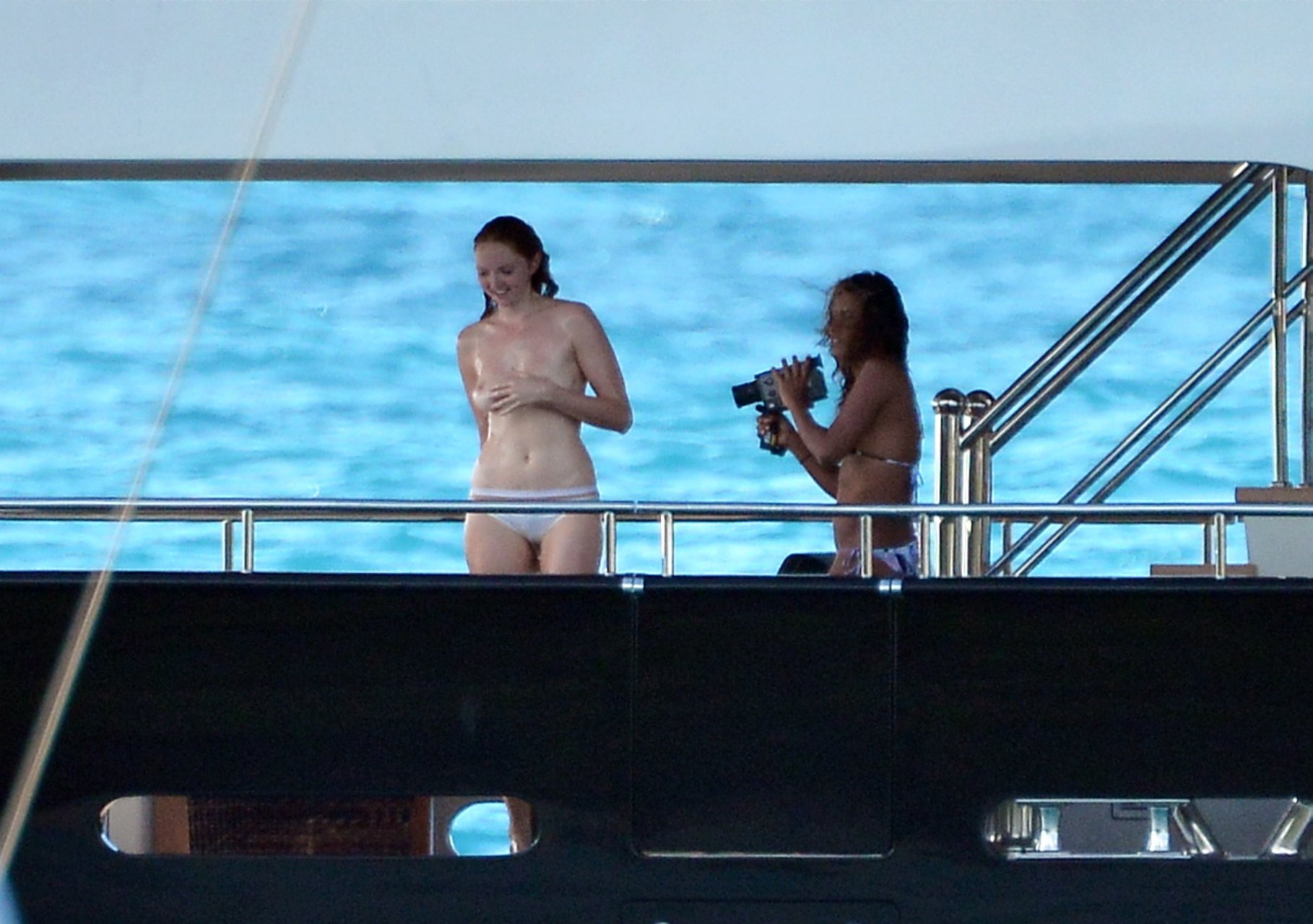 Lily Cole was caught topless by paparazzi on a yacht in St Barts, 02/01/201...
