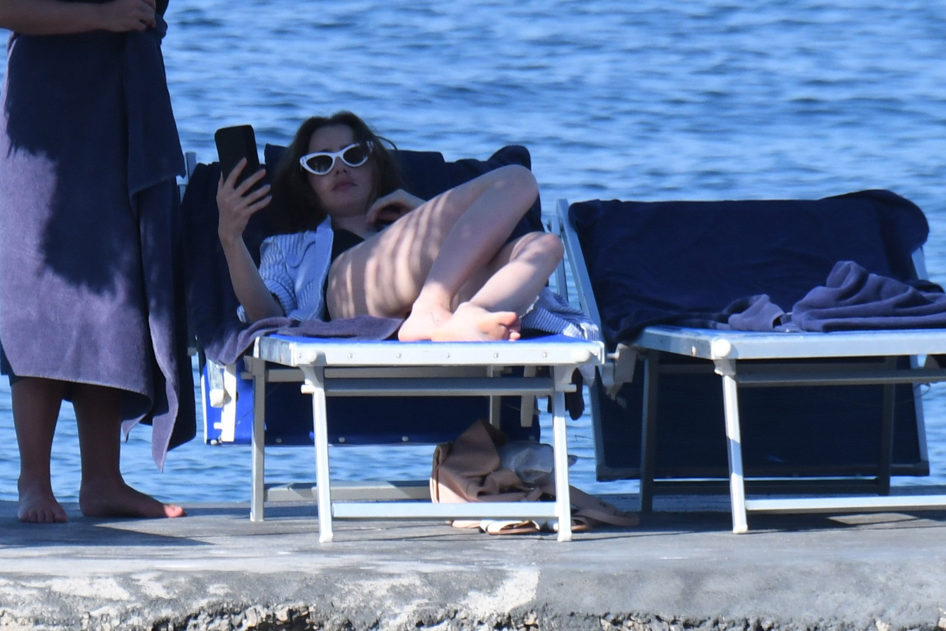 Lily Collins was spotted on holiday in Ischia, she took a bath in the sea i...