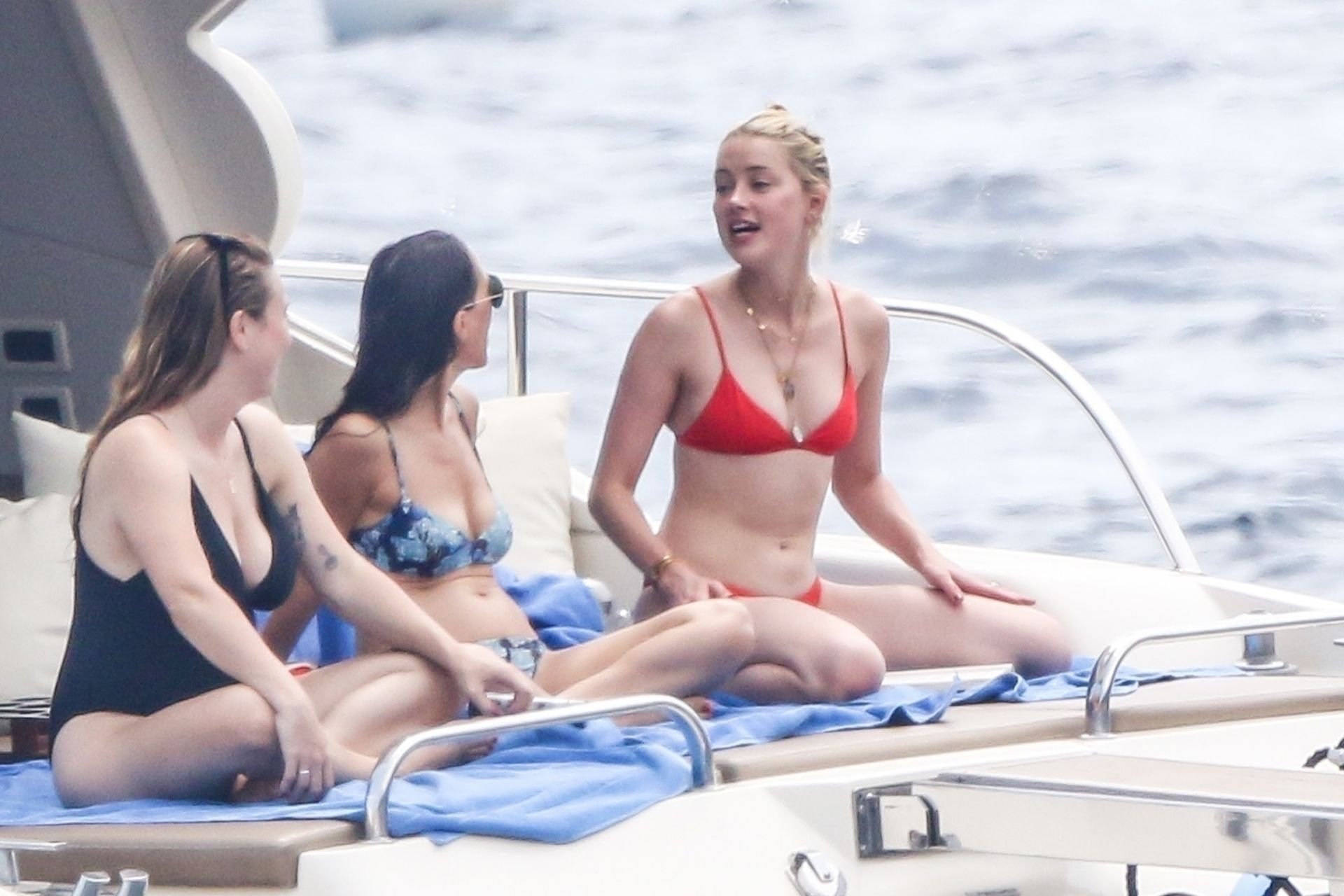 Johnny Depp’s ex wife, actress Amber Heard enjoys a day in a red bikini wit...