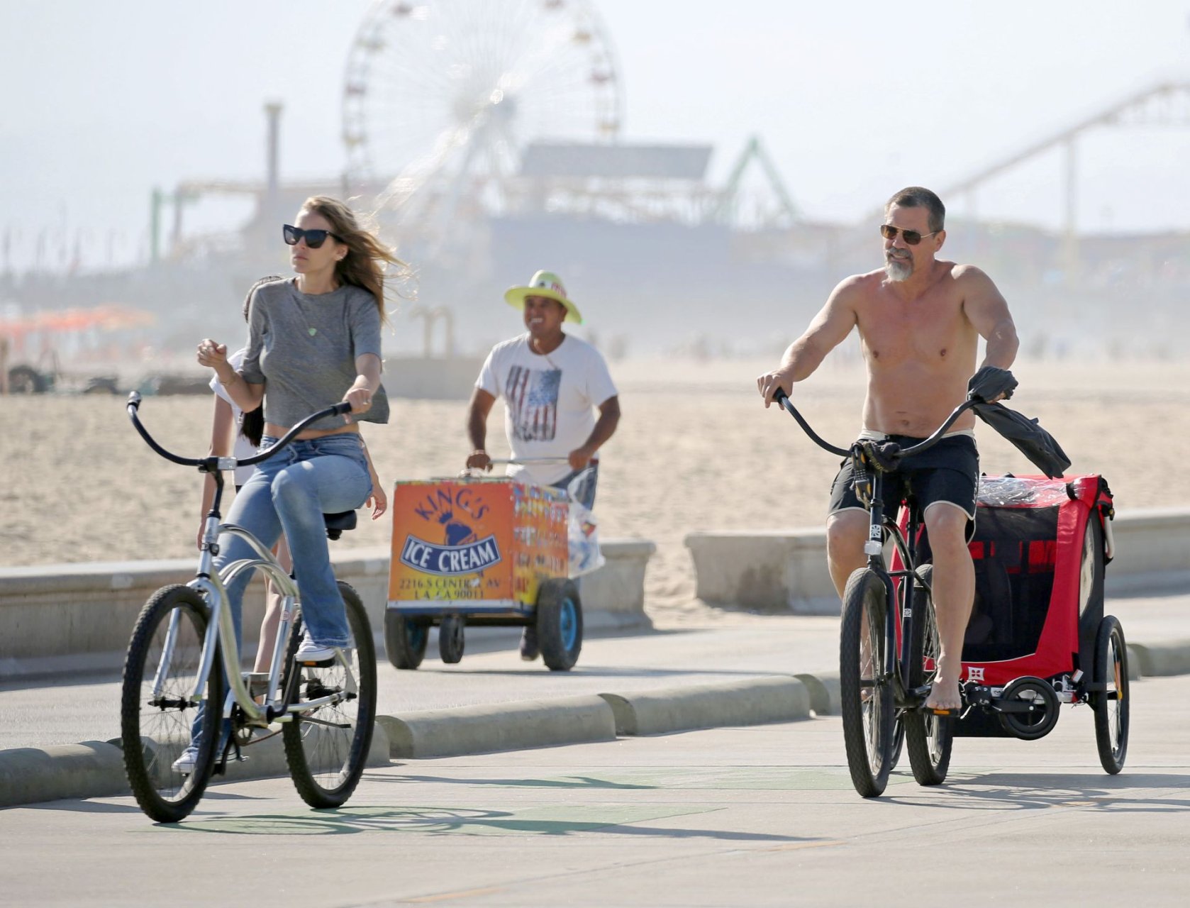 Josh Brolin and Kathryn Boyd ride bicycles by the beach in Santa Monica, Ca...