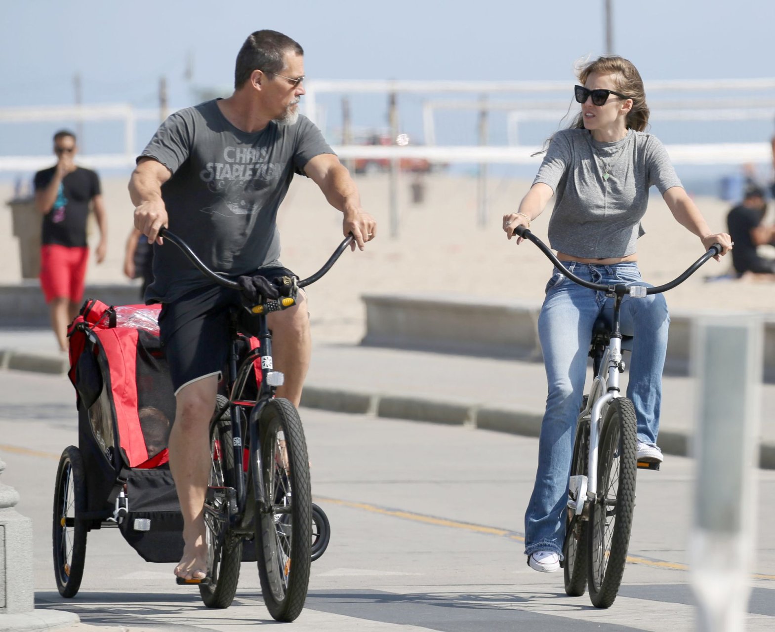 Josh Brolin and Kathryn Boyd ride bicycles by the beach in Santa Monica, Ca...
