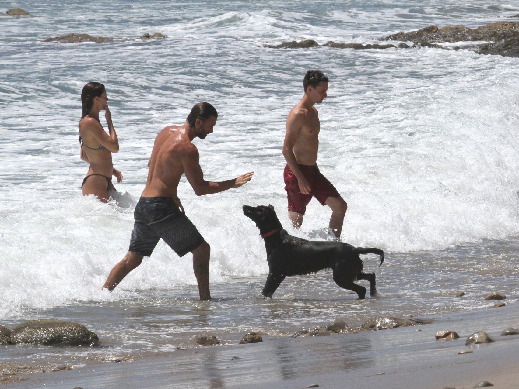 Brandon Jenner shirtless swimming in the ocean with a pregnant girlfriend, Cayley...