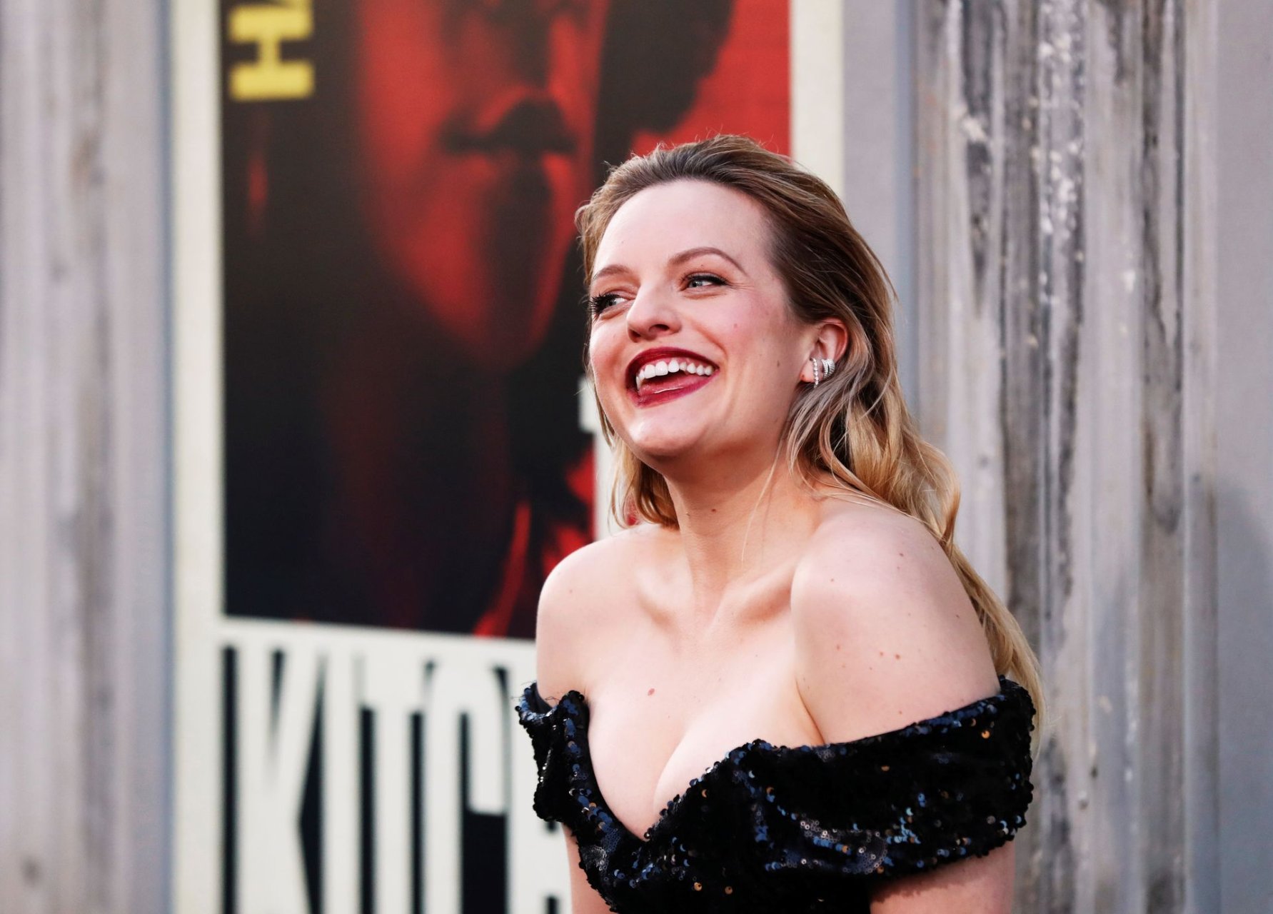 Elisabeth Moss showed off her cleavage and sexy legs at the premiere of War...