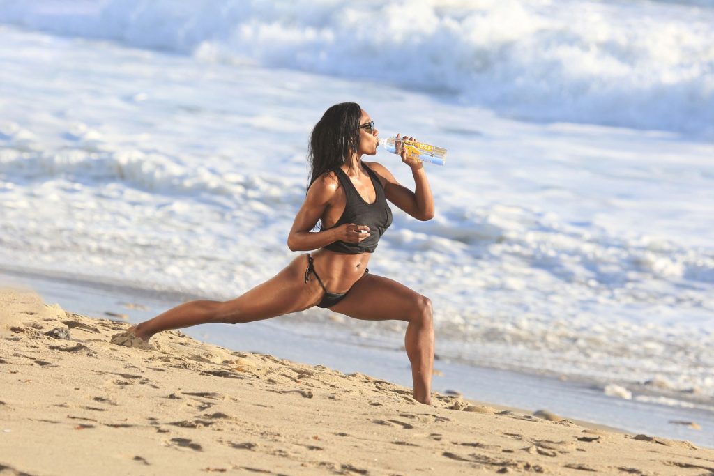 Leaked adrianne nina posing topless and bikini on a beach