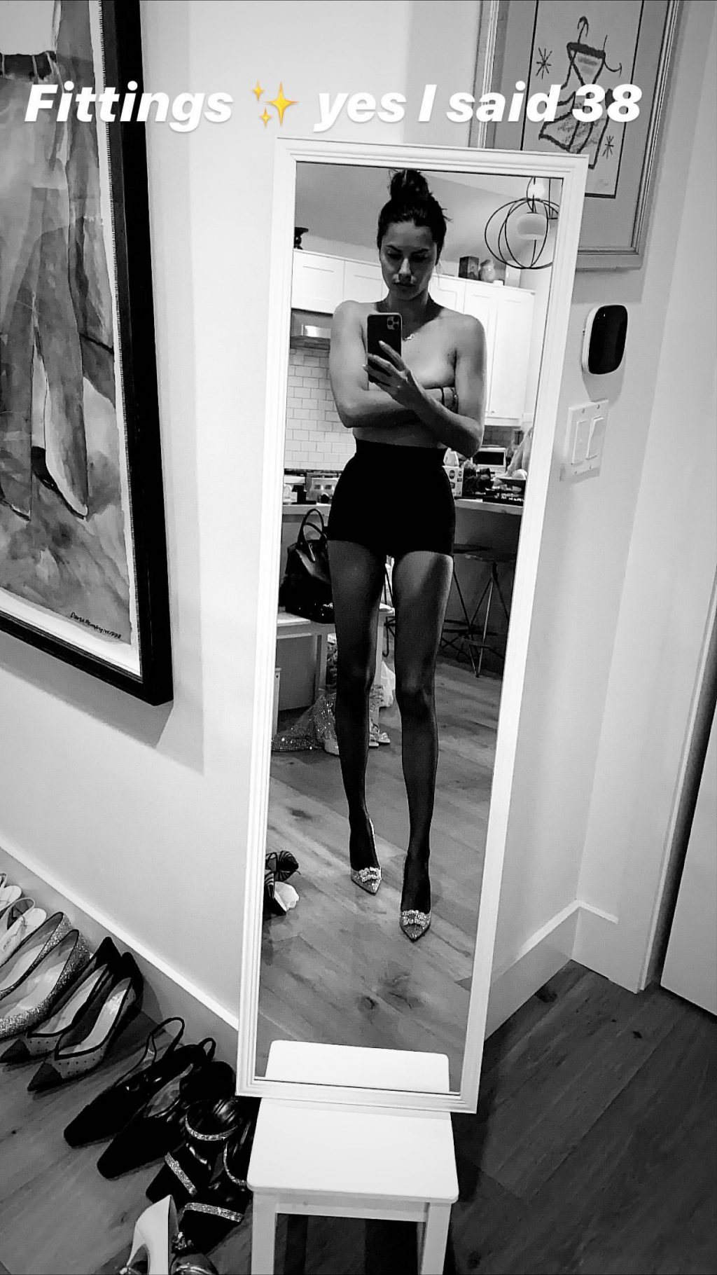 Adriana Lima Poses Topless (2 Photos)