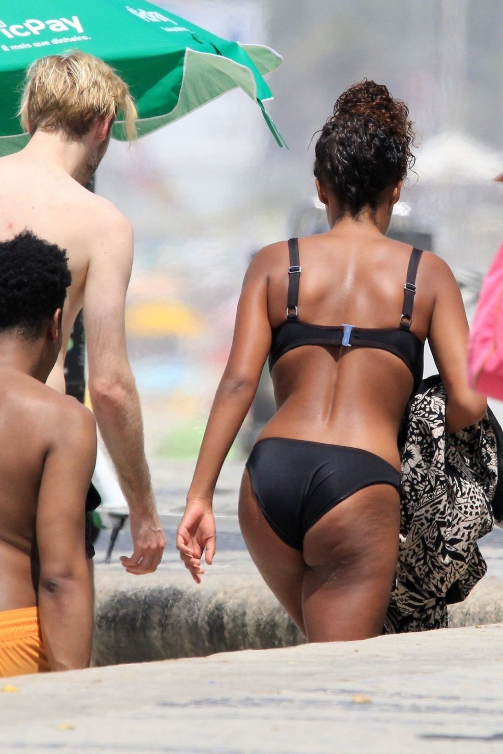 Tina Kunakey Enjoys the Rio Sunshine in a Sexy Black Bikini (27 Photos)