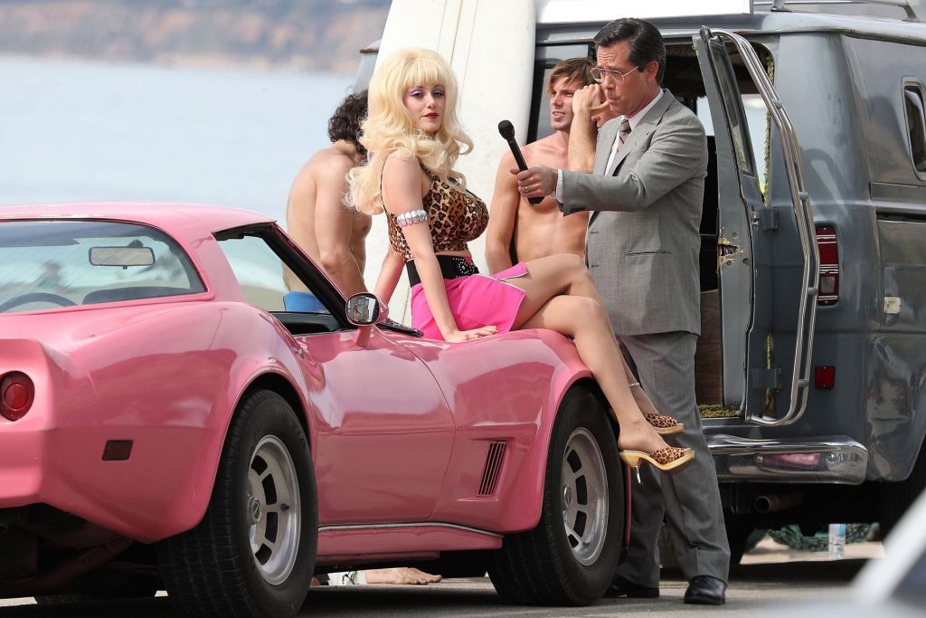 Emmy Rossum Flaunts her Cleavage as She Films Angelyne in Malibu (21 Photos)