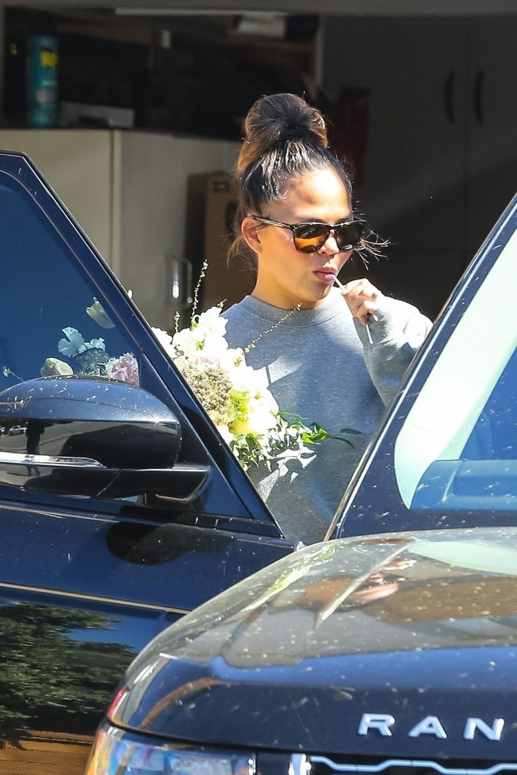 Chrissy Teigen Tweets About Helping The Paparazzi! Gives Them Donuts &amp; Pictures! (28 Photos)