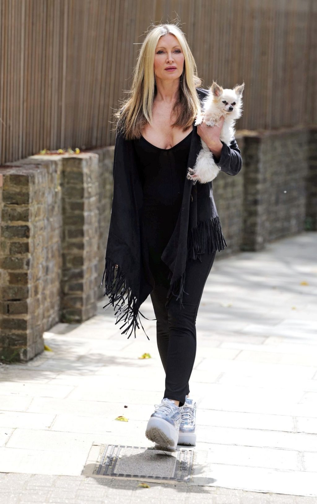 Caprice Wears Plunging Black Vest Top in London (24 Photos)