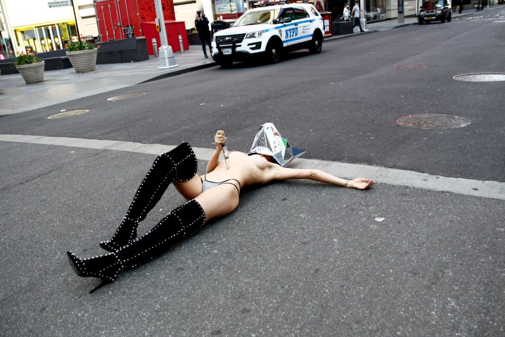 Medical Worker De-Stressed and Disrobed in a Piece of Street Performance Art (10 Photos)