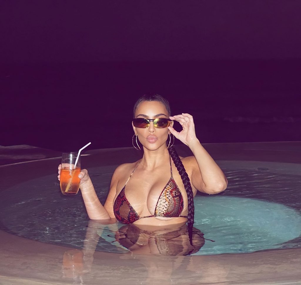 Kim Kardashian Poses in the Pool (3 Photos)