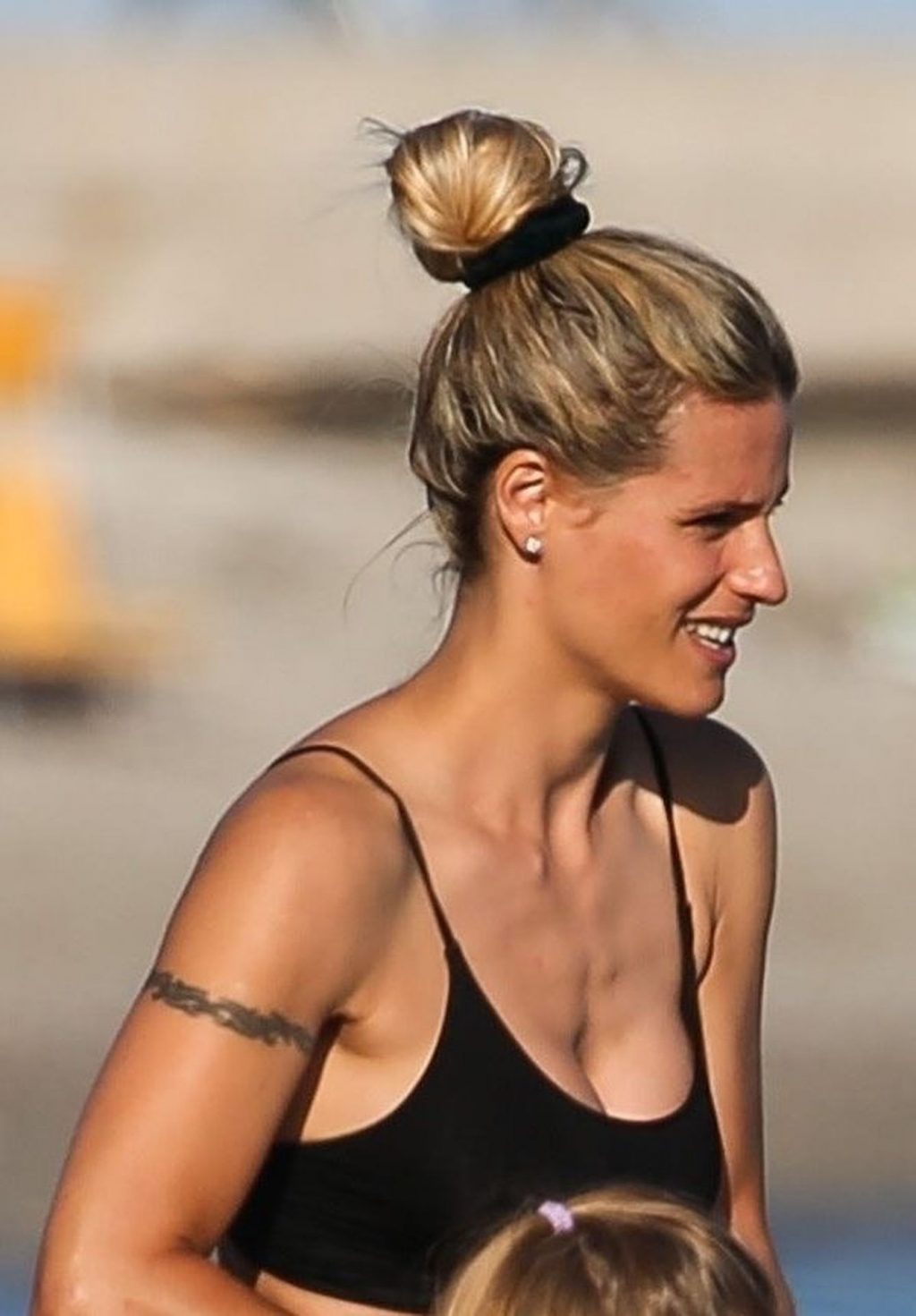 Michelle Hunziker Enjoys a Day on the Beach with Her Family (13 Photos)