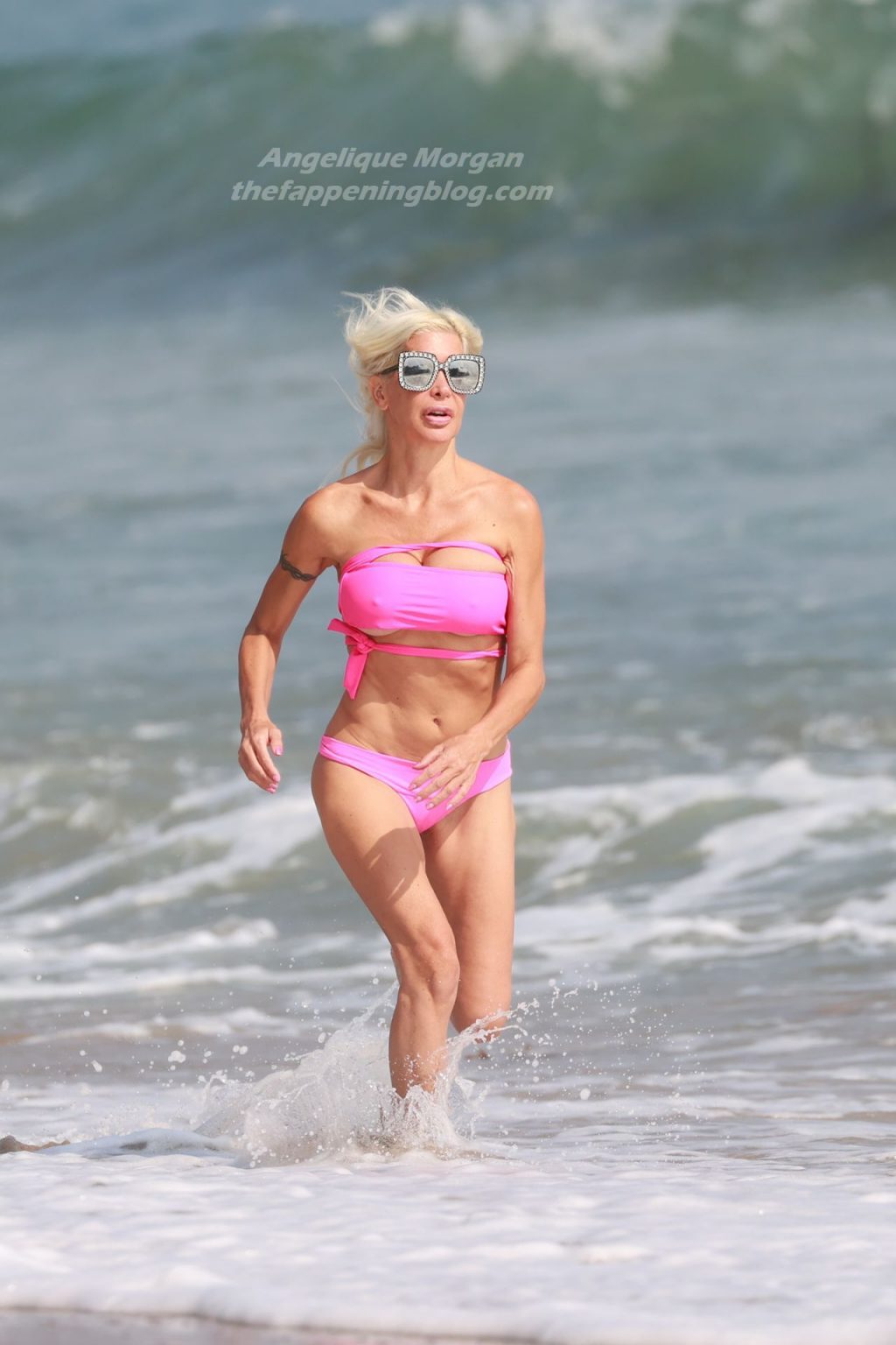 Angelique Morgan Enjoys a Day on the Beach in a Pink Bikini (14 Photos)