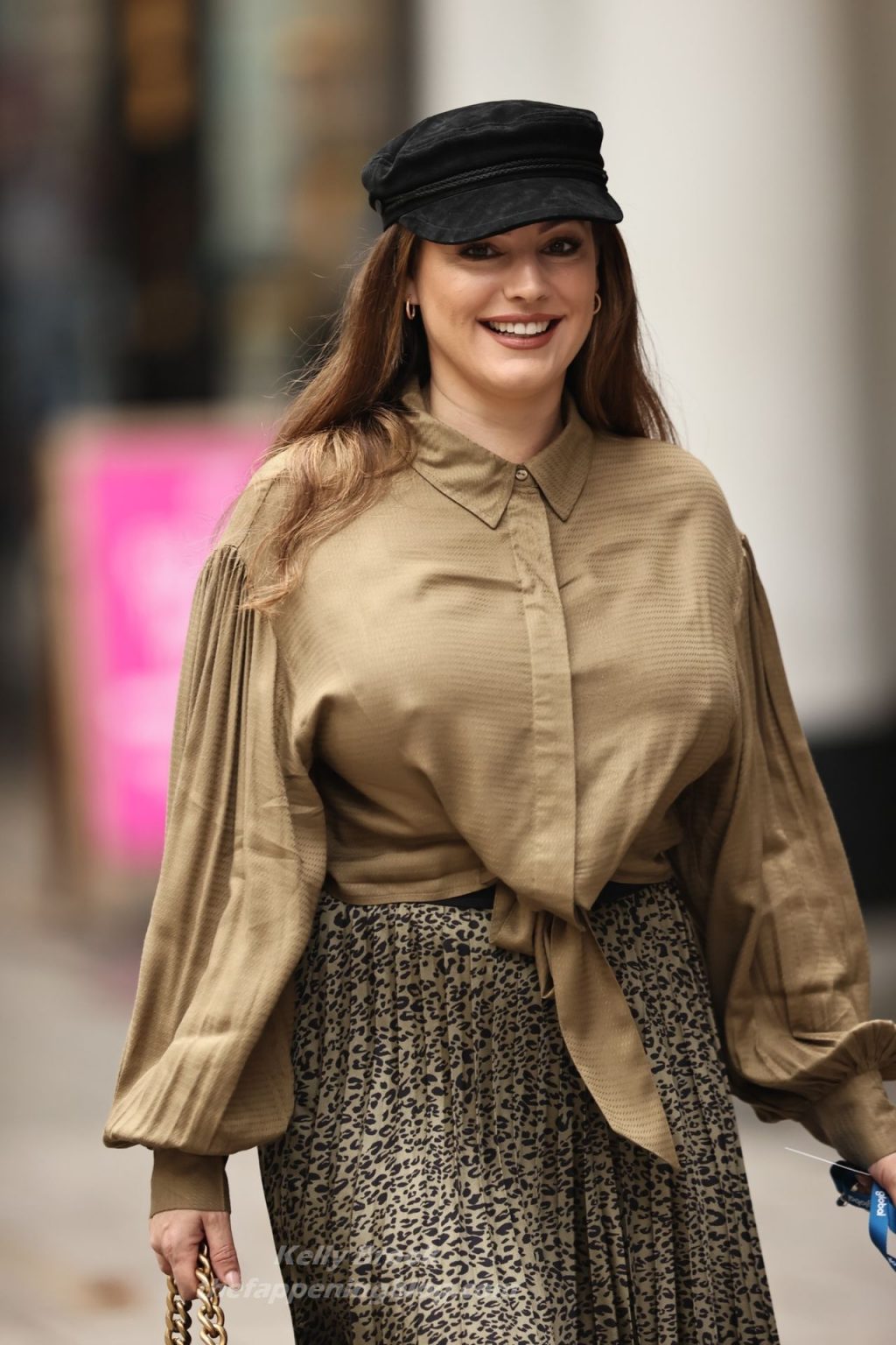 Kelly Brook Arrives at Heart Radio in a Busty Blouse and Pleated Skirt (65 Photos)